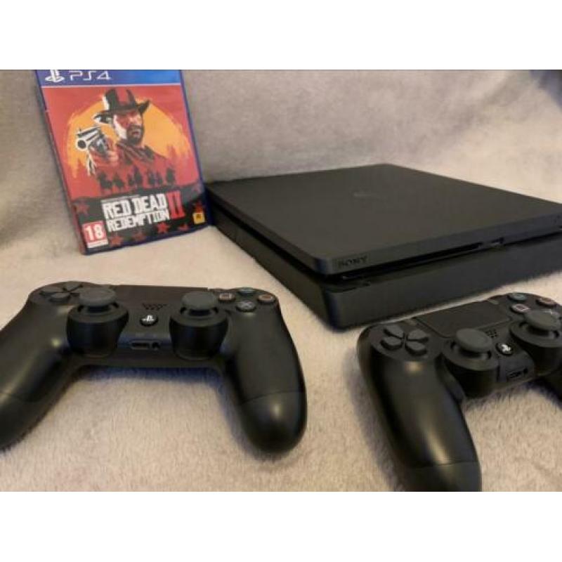 PlayStation 4 met 1TB + 2 controllers + koptelefoon +1 spel