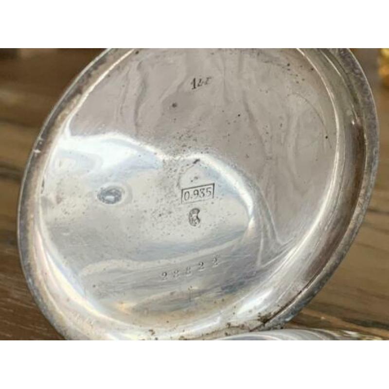 Zilver zakhorloge met sleuteltje